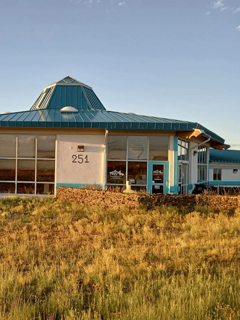 Aqua Blue Roofed Building with Large Windows at Quest for Directions, 251 Address.