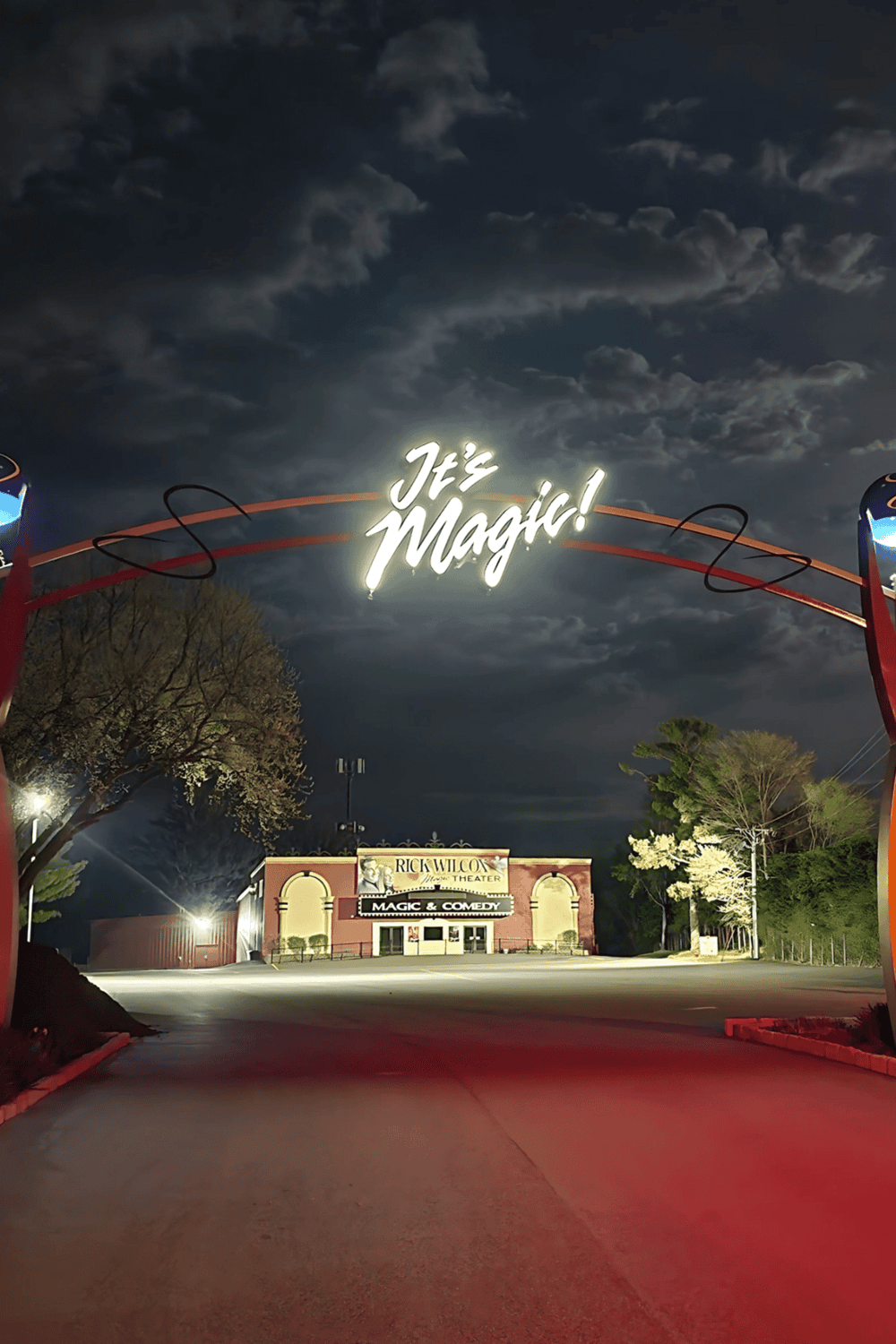 1. Neon sign that says "It's Magic!" over the Rick Wilcox Theater at night.
