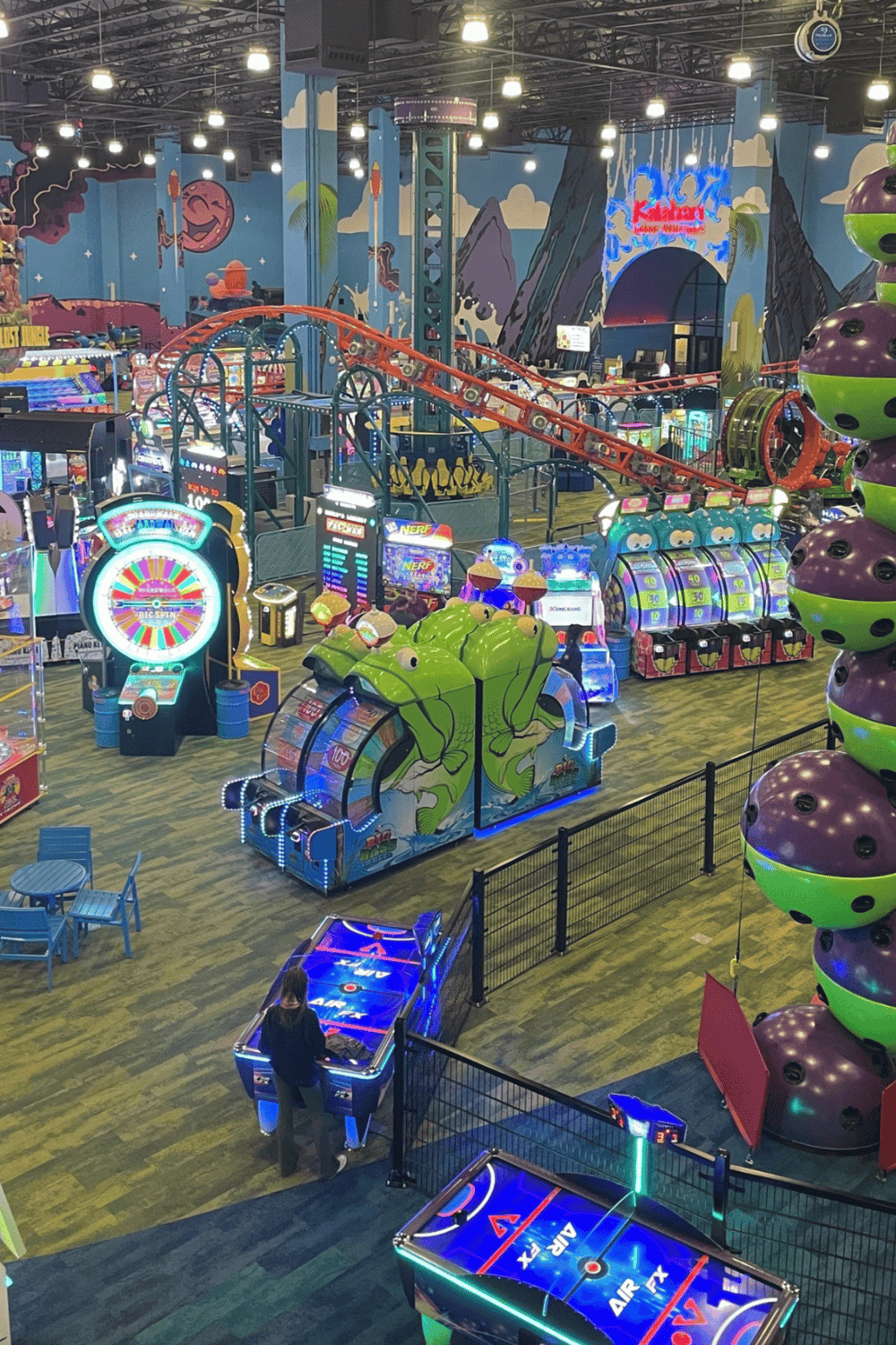 Colorful arcade and amusement park rides with lively gaming attractions and vibrant decor.