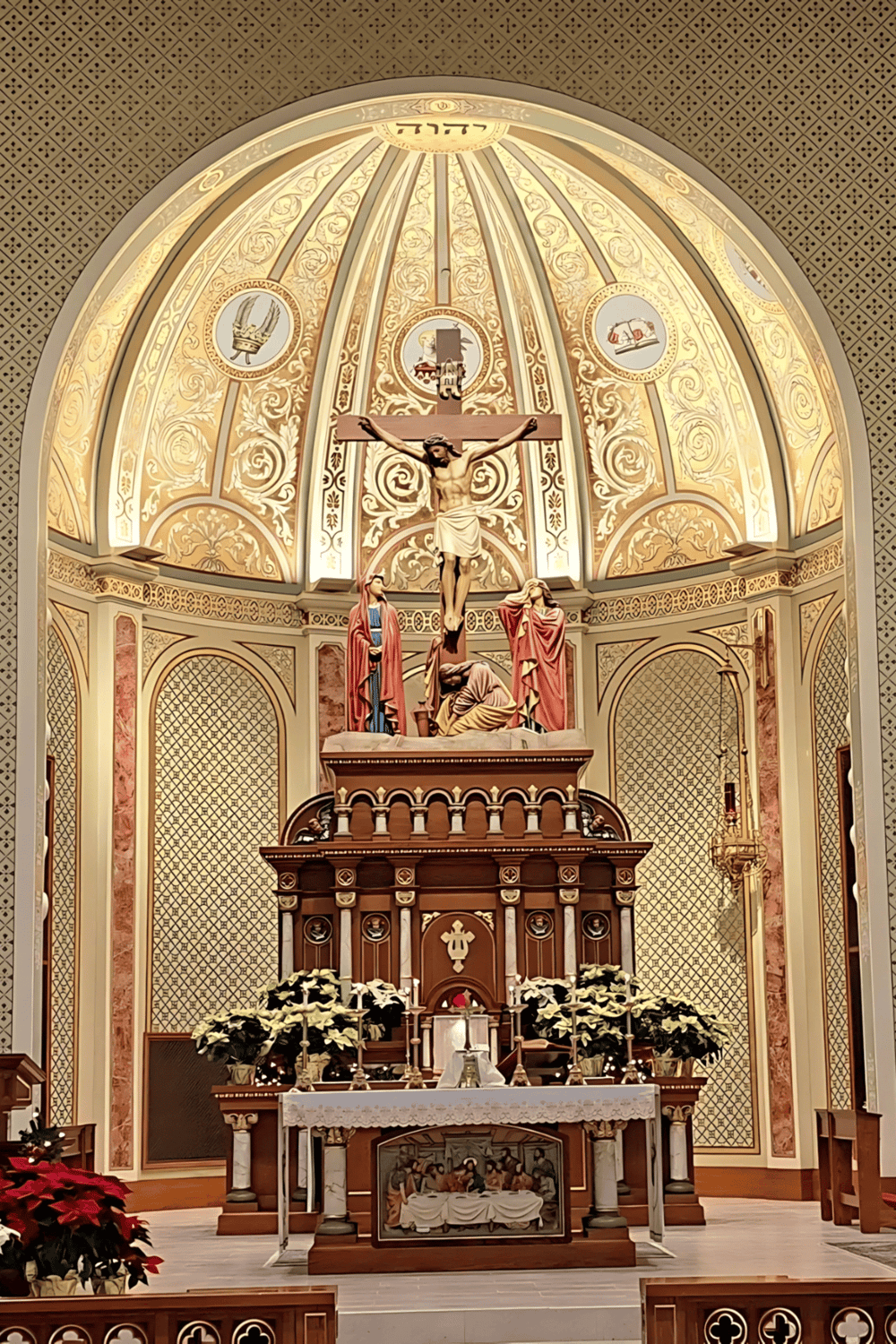 1. Intricate church altar with crucifix and ornate gold decorations.