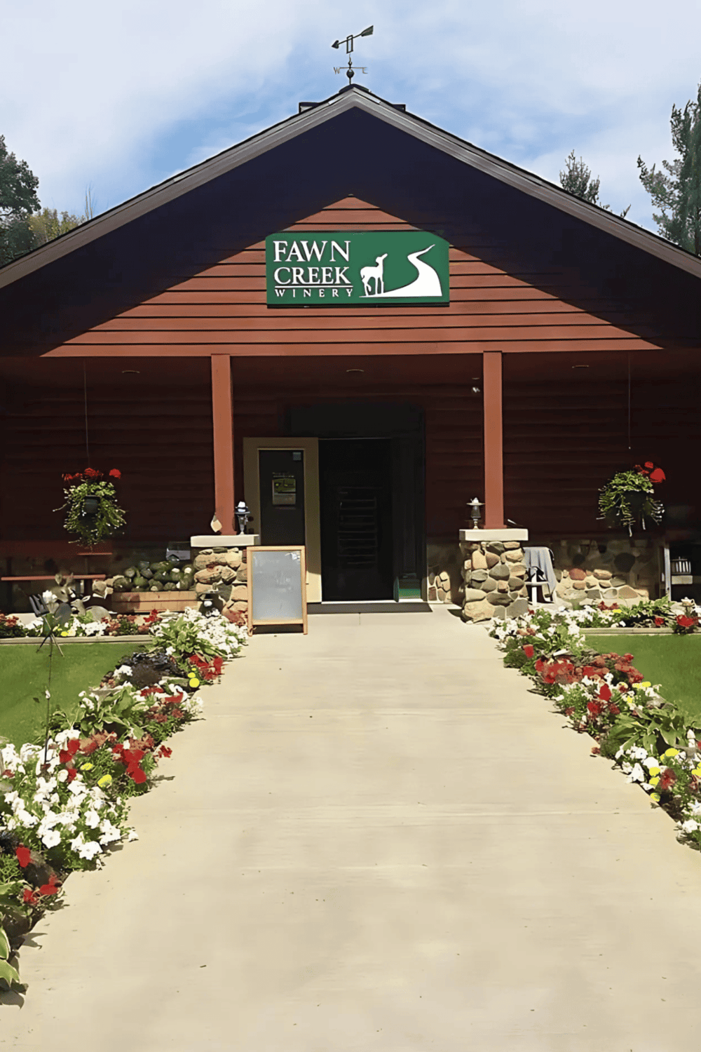 Charming winery entrance at Fawn Creek Winery with garden surrounds and outdoor decor.