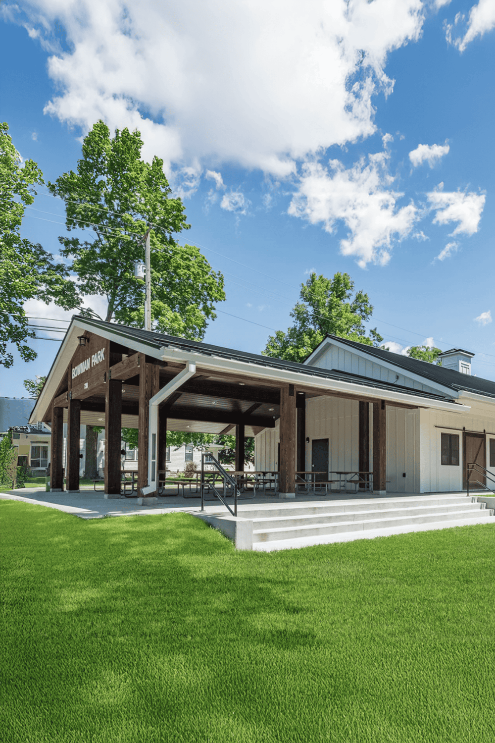 Accessible outdoor community space at Bowian Park with modern pavilion and green lawn.