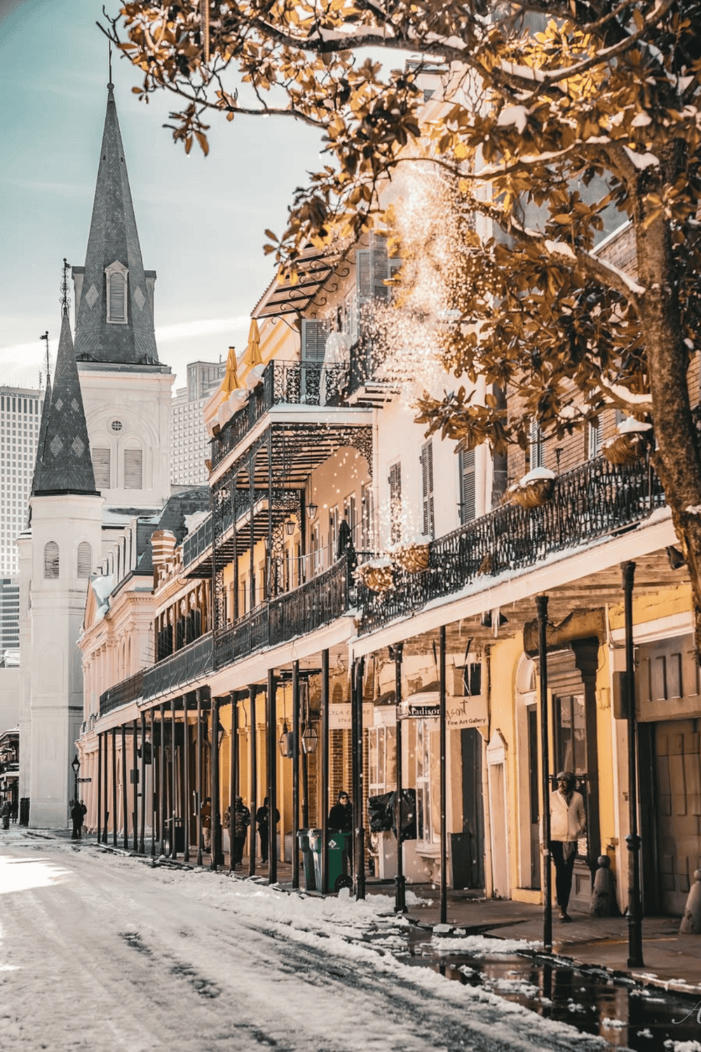 Charming historic buildings on a snowy street in New Orleans, capturing the city's unique architecture and vibrant atmosphere.