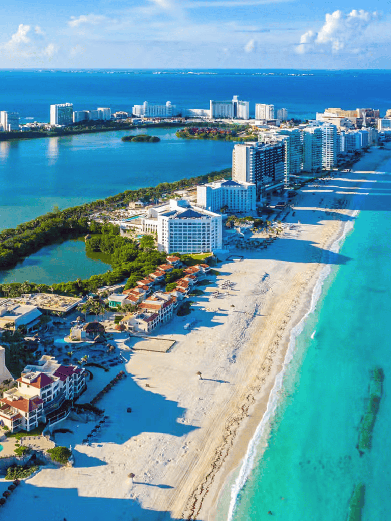 Stunning coastal cityscape with beaches, high-rise hotels, and vibrant ocean views in the Caribbean.