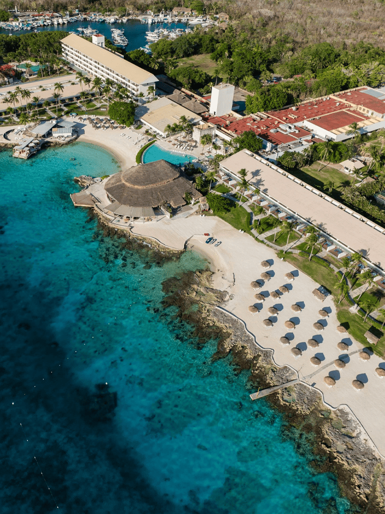 Relaxing beach resort with ocean views and poolside lounging in a tropical setting.
