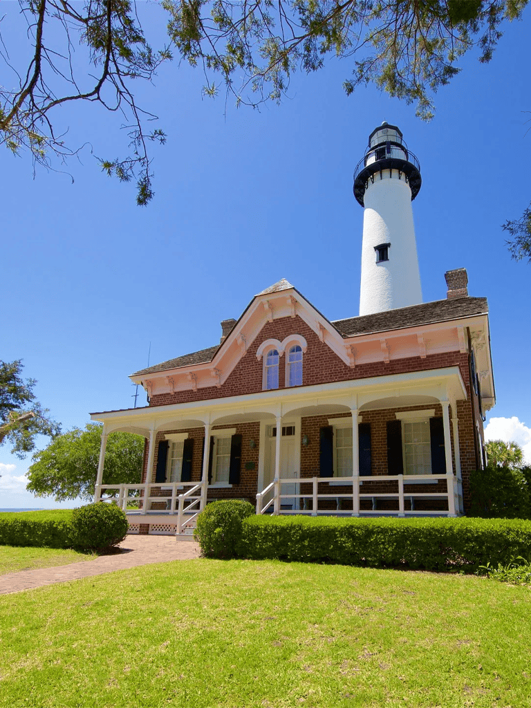 Charming lighthouse house with scenic ocean views and well-maintained gardens.