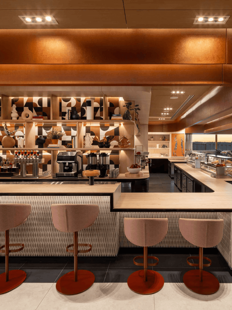 Luxurious modern hotel bar with stylish decor, cozy seating, and ambient lighting for guests.