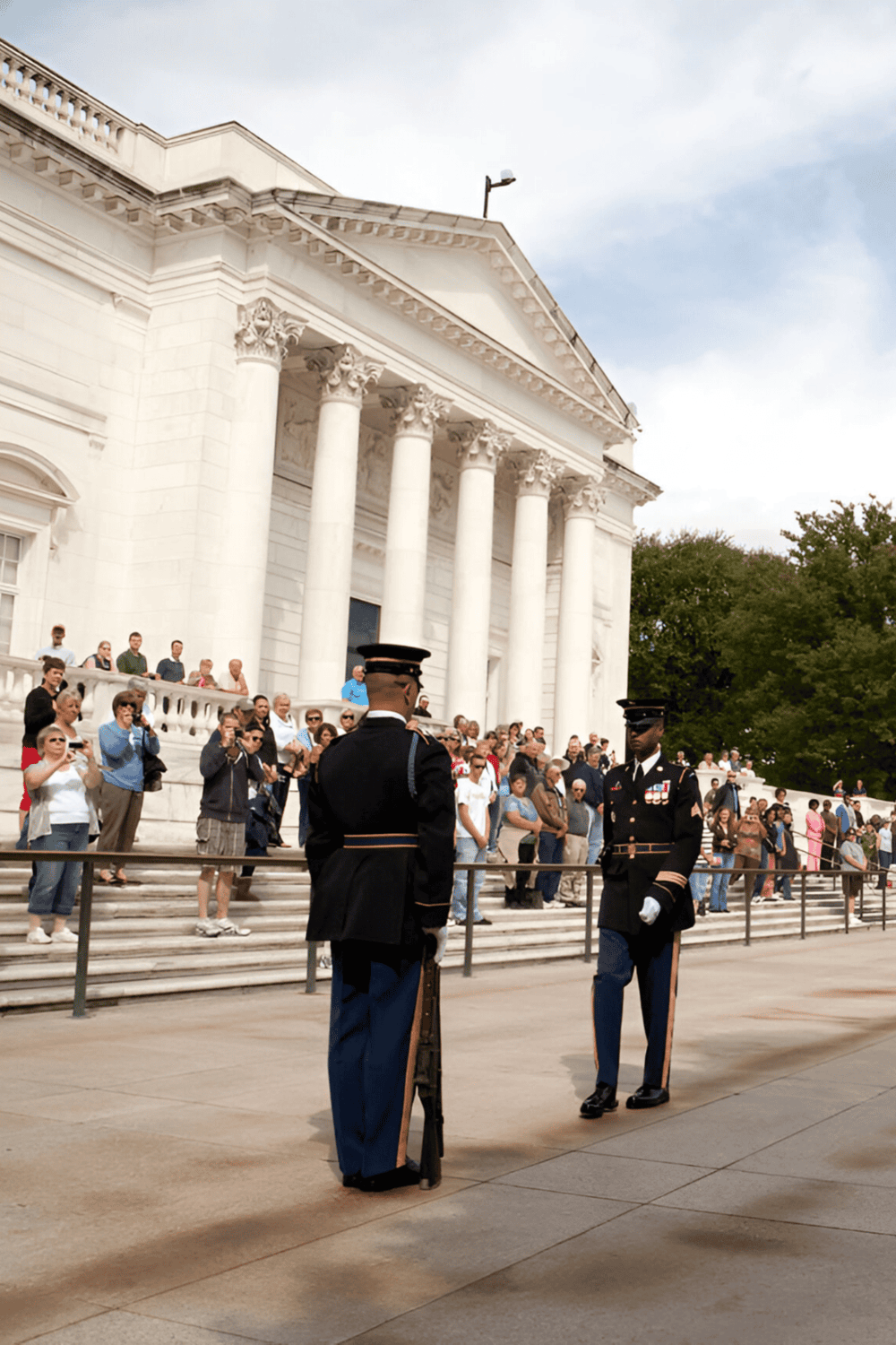 1. Military guards standing in front of the White House during a public event.