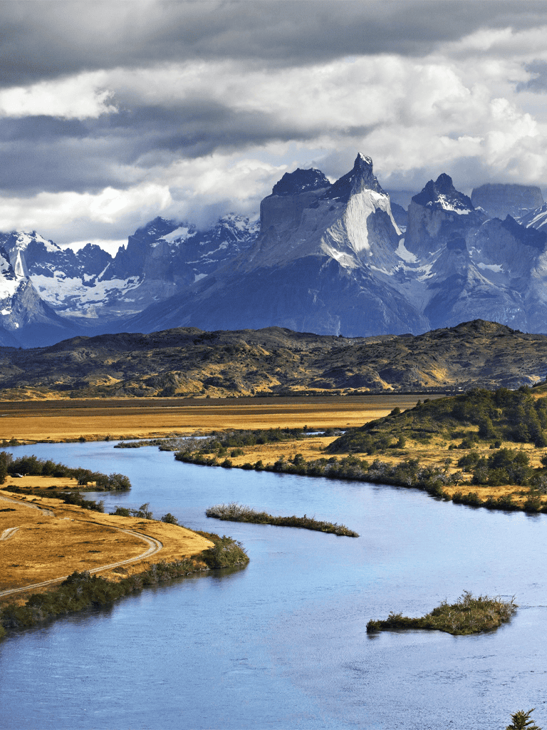 Stunning mountain landscape with river and rugged terrain in Patagonia, Chile.