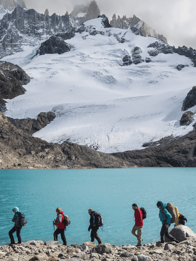 Snow-capped mountain, glacier, group of hikers by turquoise lake, adventure travel, exploration, nature trekking, outdoor activity, scenic wilderness, mountain trekking, QuestForDirections.