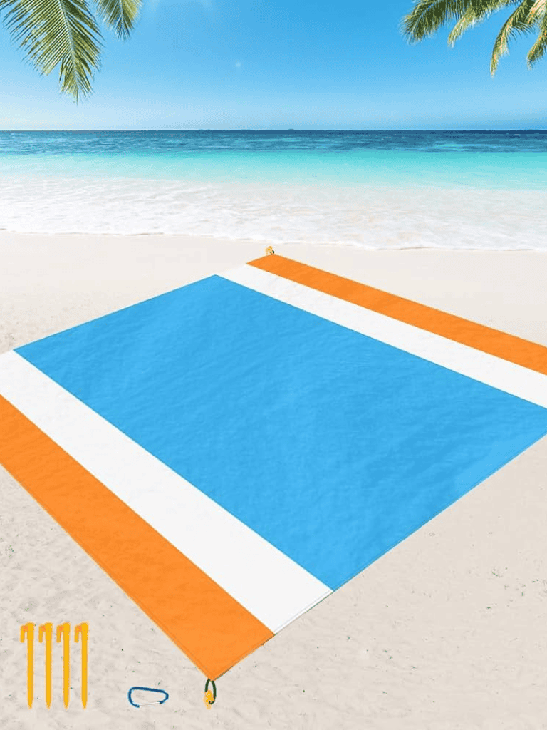 Bright beach hammock on sandy shore with ocean view at tropical destination.