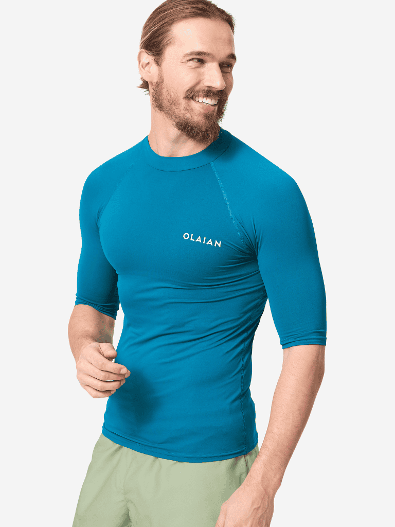 High-performance blue athletic shirt, Olaián brand, for active outdoor pursuits and sports.