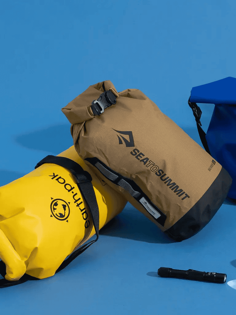 Waterproof dry bag with Quest for Directions logo for outdoor adventure gear.