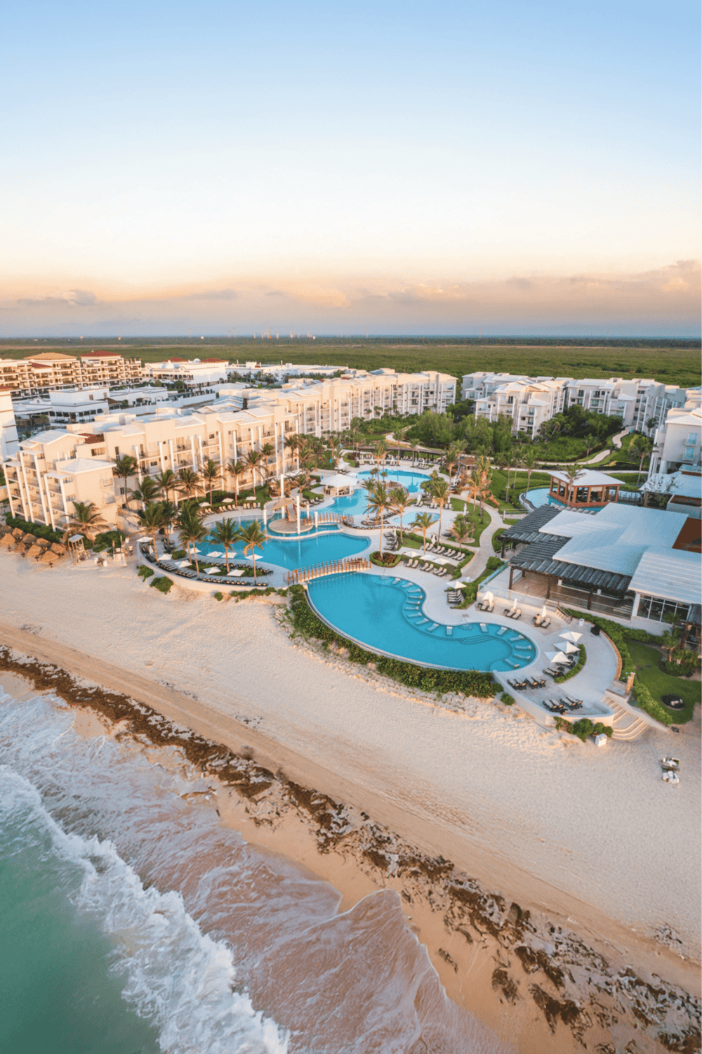 Luxurious beachfront resort with pools and ocean views at QuestForDirections.