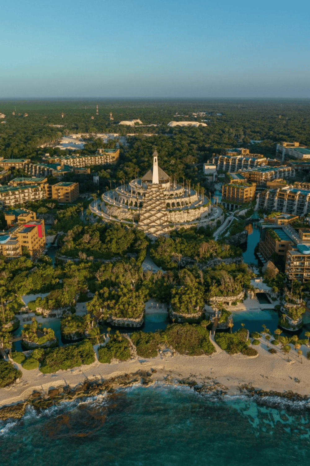 Luxurious resort with ocean views, tropical landscape, and iconic religious-structure centerpiece.