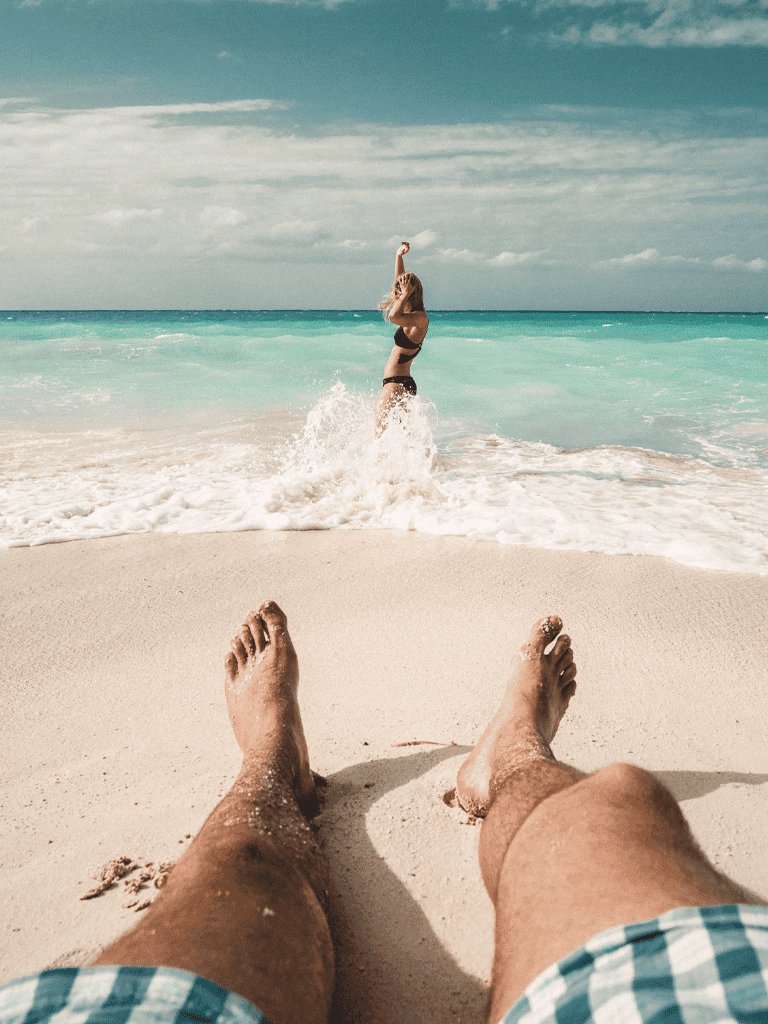 Relaxing beach vacation destination on white sandy shores with turquoise waters.
