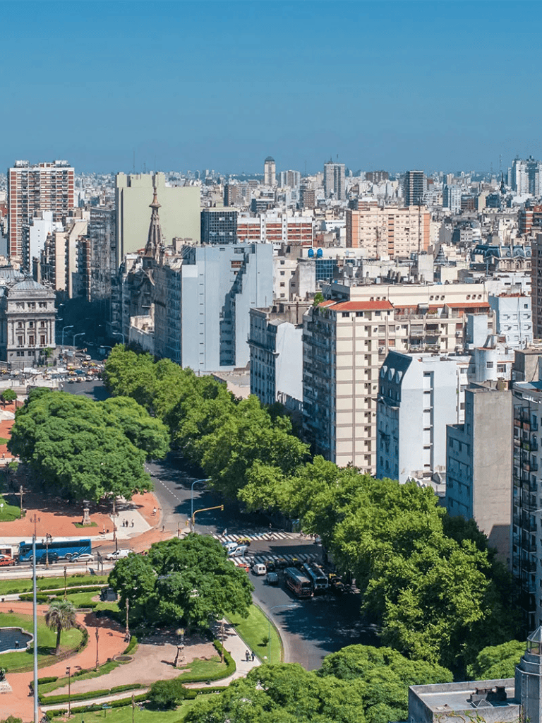 Modern cityscape with green park and tall buildings in downtown Paris, France.