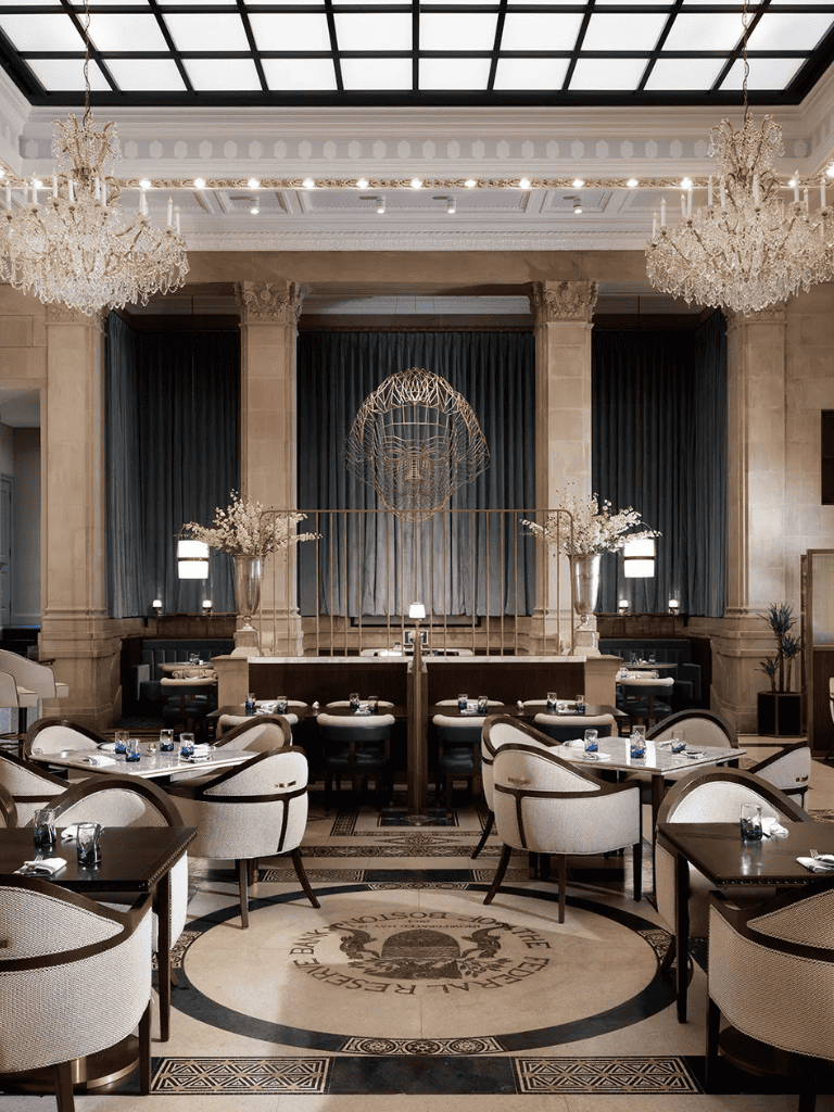 Elegant hotel restaurant interior with chandeliers, luxury decor, and sophisticated ambiance for fine dining experiences.