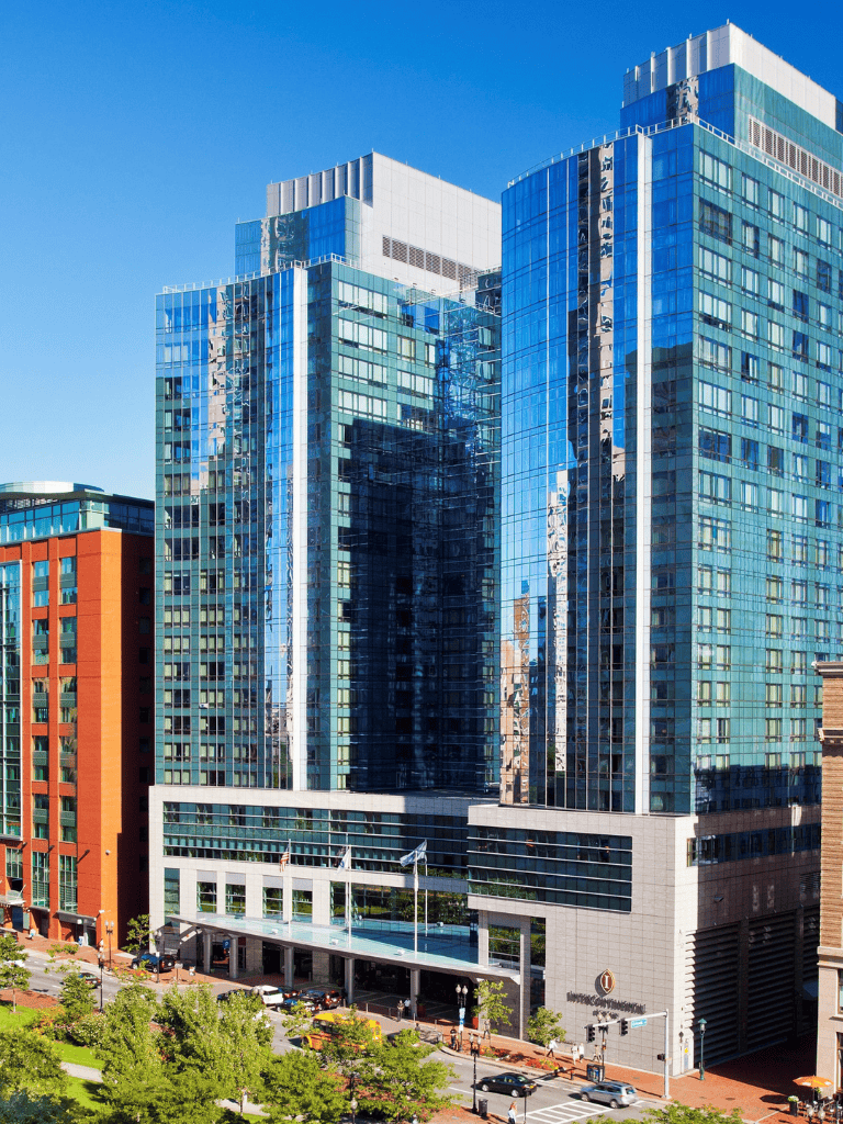 Modern glass skyscraper in downtown skyline.