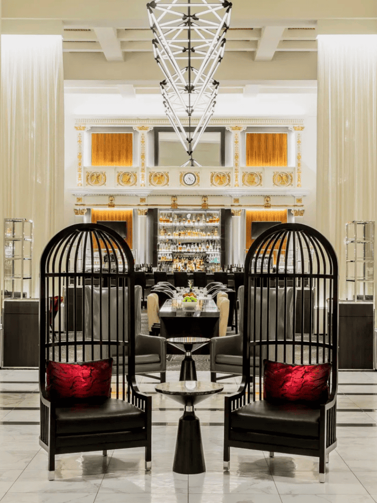 Luxurious hotel lobby with elegant seating area and modern lighting design.
