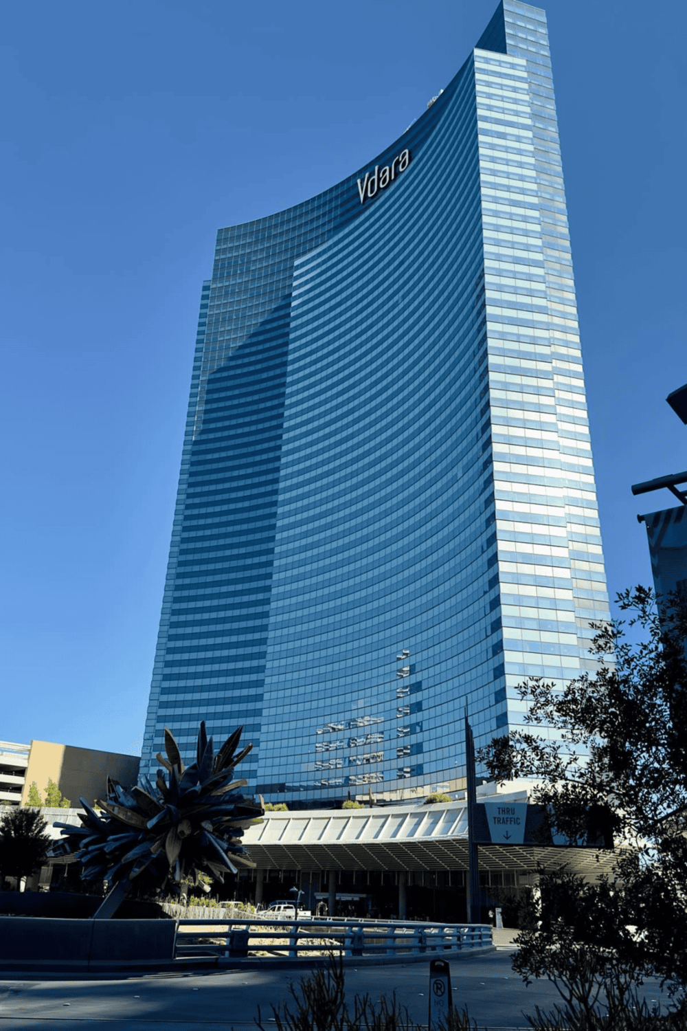 1. Modern glass office skyscraper with "Vdara" sign in a downtown skyline.