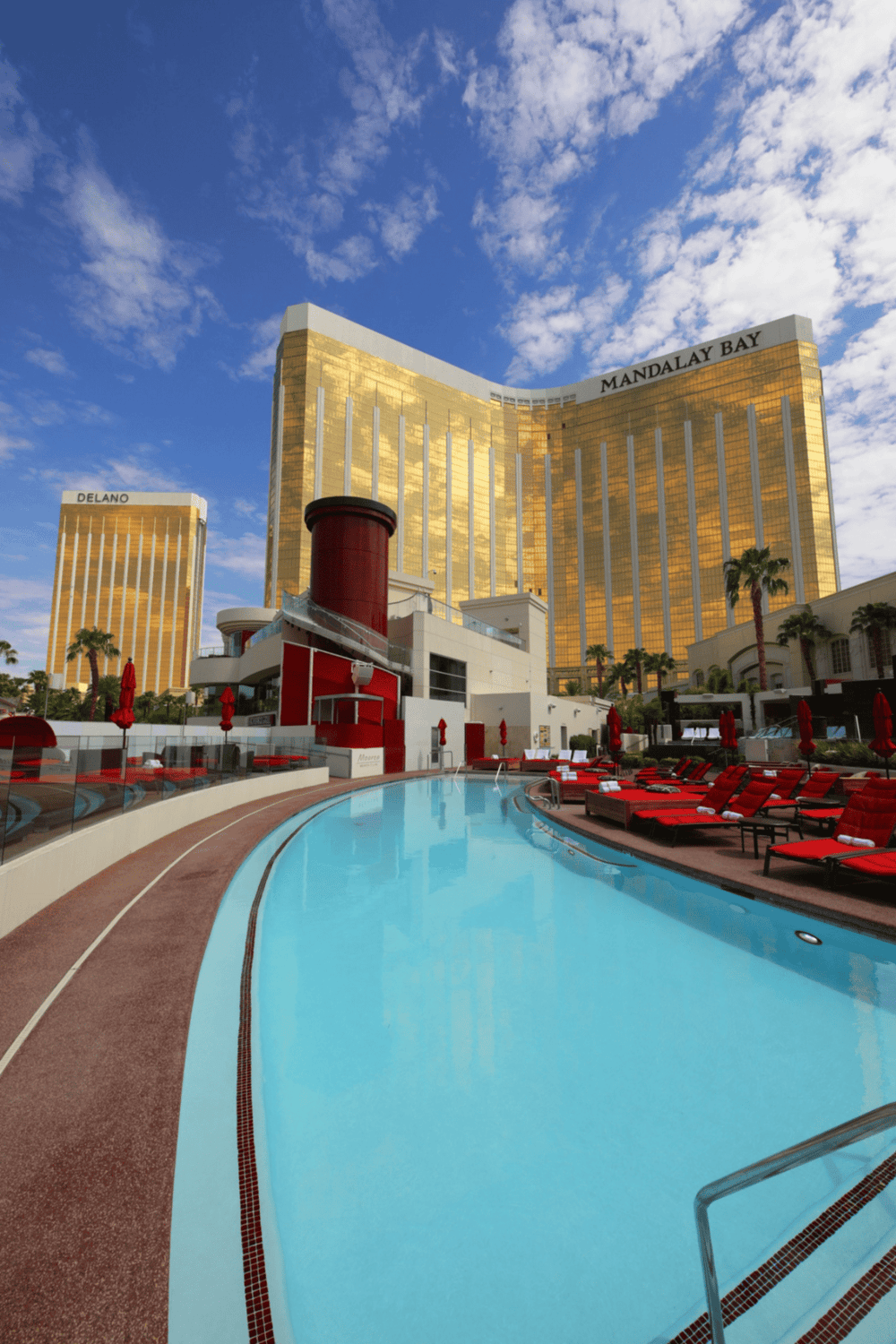 Luxury hotel pool at Mandalay Bay Las Vegas with skyline view.