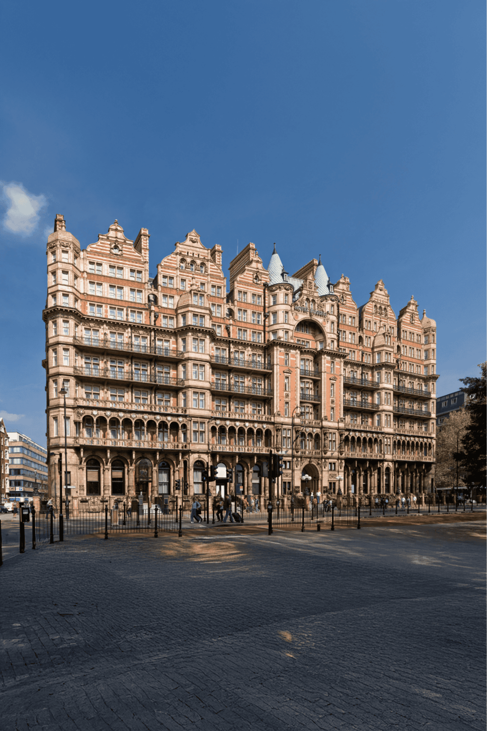 Elegant historic hotel with Victorian architecture in a city setting, perfect for travel planning.