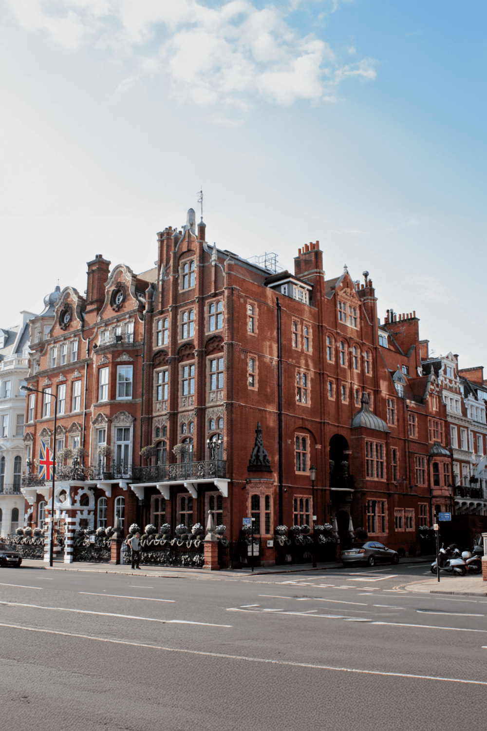 Elegant historic red brick building in London with intricate architectural details; perfect for travel guides.