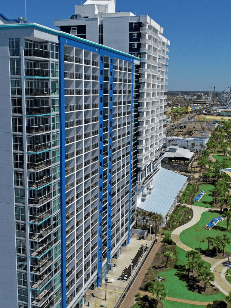 Modern high-rise beachfront condominium with ocean views and amenities.