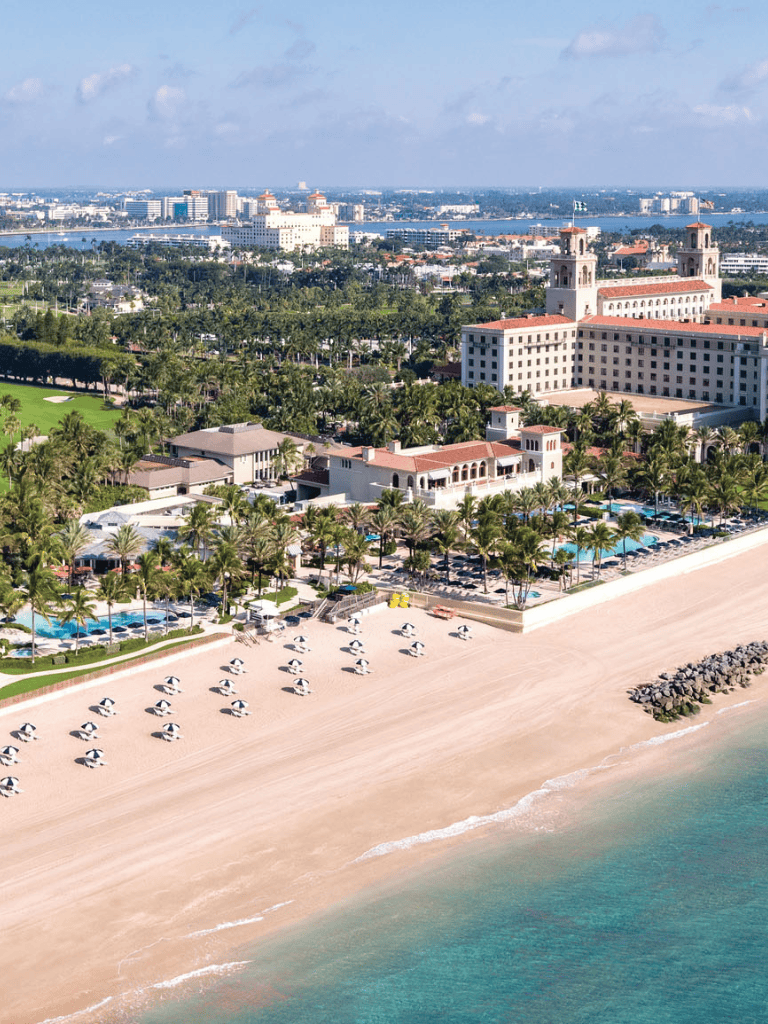 Luxurious beachfront resort with pools and palm trees in Fort Lauderdale, Florida.