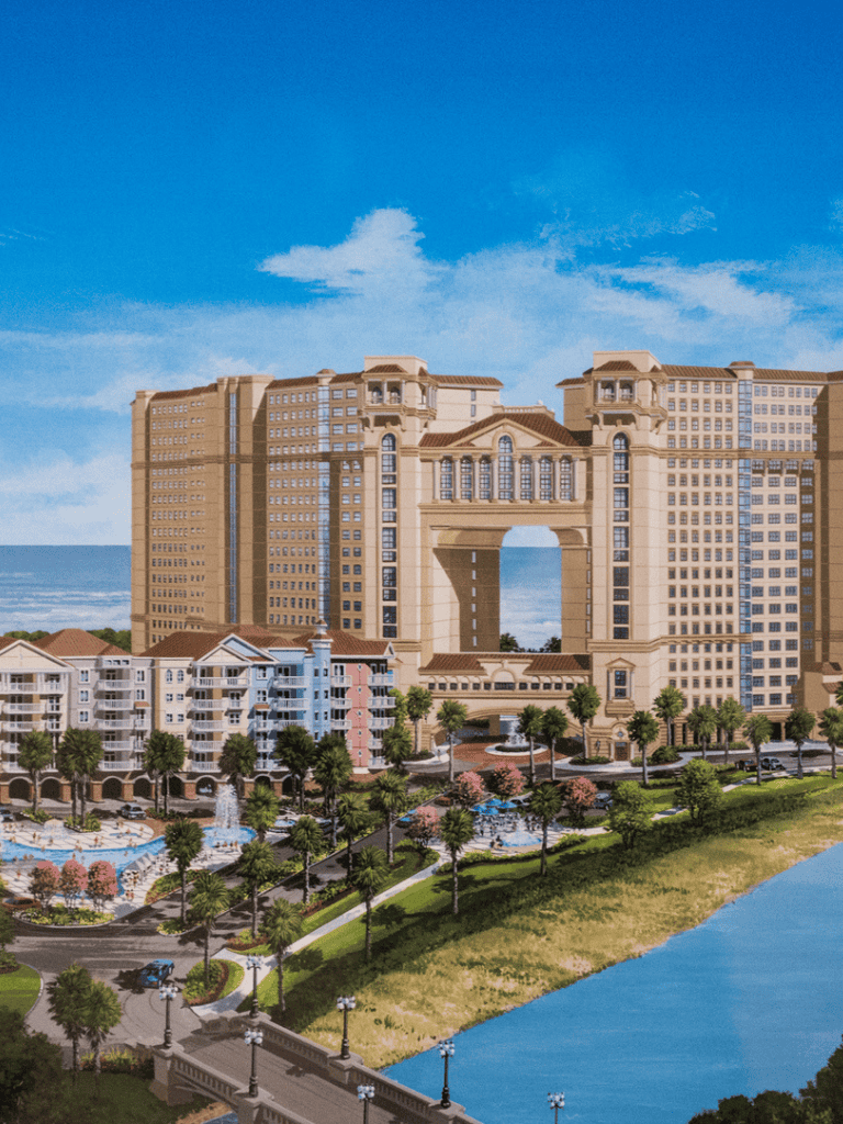 Luxury coastal hotel with high-rise towers and resort amenities near the beach.