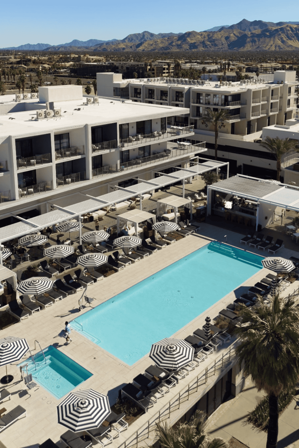 Modern hotel with rooftop pool and mountain views in Palm Springs California.