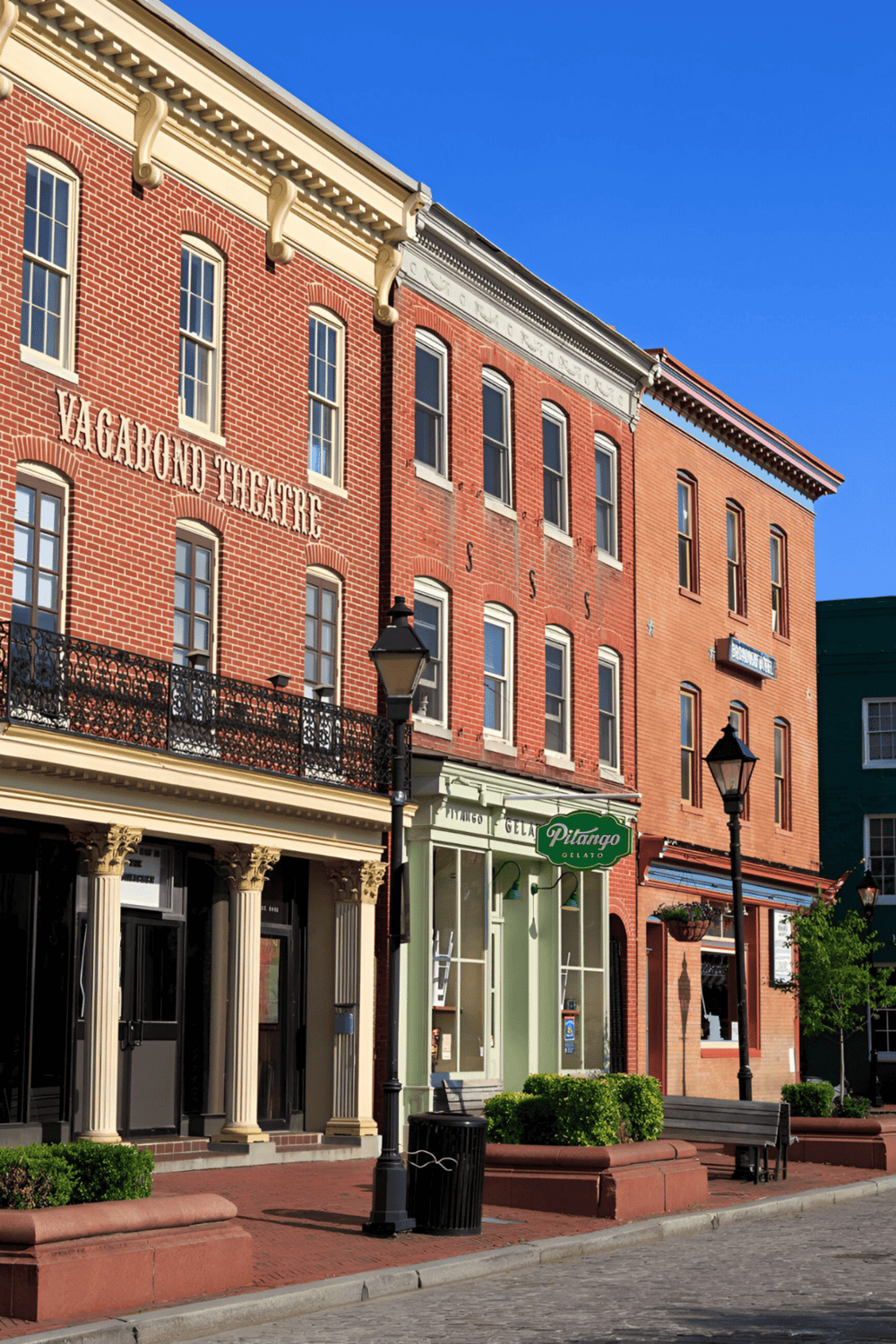 Colorful historic buildings on a charming city street, showcasing local architecture and vibrant community atmosphere.
