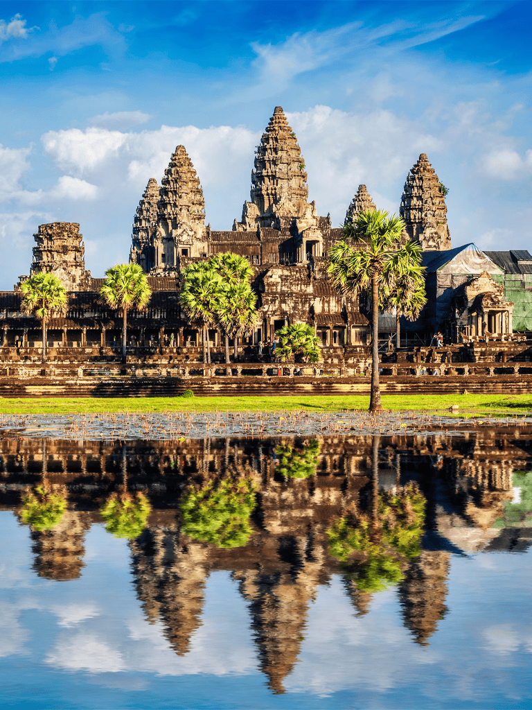 Ancient Angkor Wat temple in Cambodia with reflection in water, UNESCO World Heritage site.