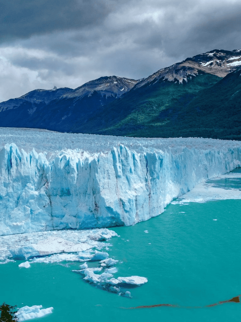 Stunning glacier and snow-capped mountains in Alaska, ideal for adventure travel and nature exploration.