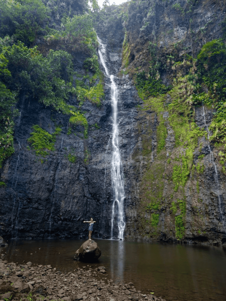 Serene waterfall and lush greenery in nature, perfect for adventure travel and outdoor exploration.