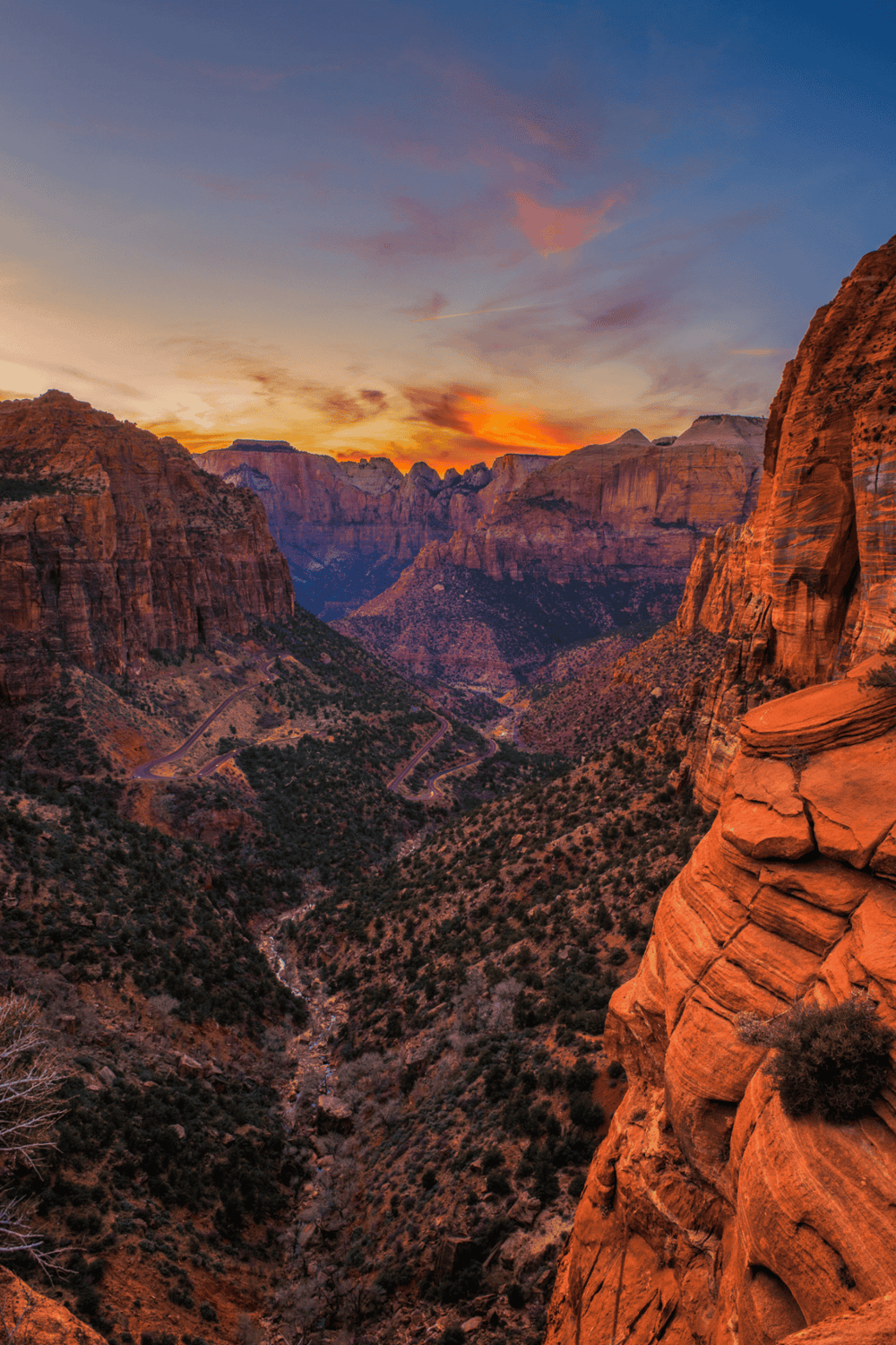 Vivid desert canyon sunset view at Zion National Park with towering red rock formations.