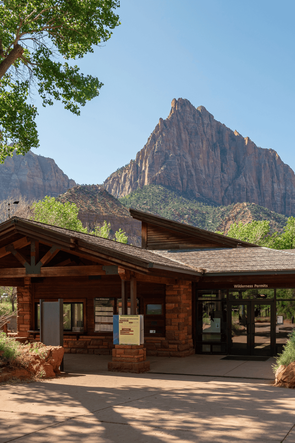 Scenic Zion National Park visitor center with mountain views and wilderness permits.