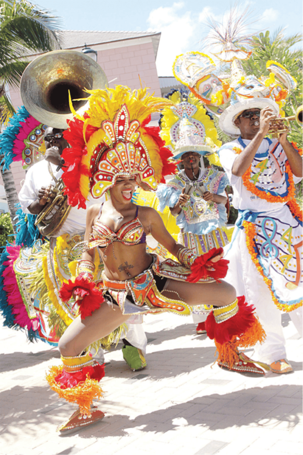 Colorful Caribbean carnival dancers in vibrant costumes for QuestForDirections tourism.