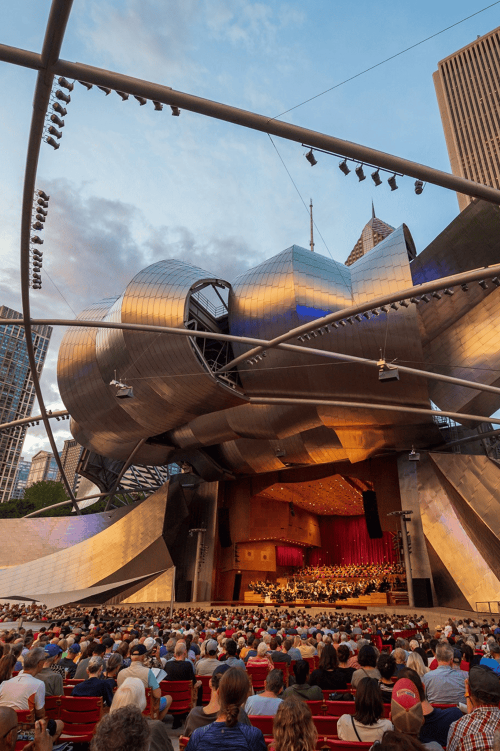 Modern concert hall architecture in downtown cityscape.