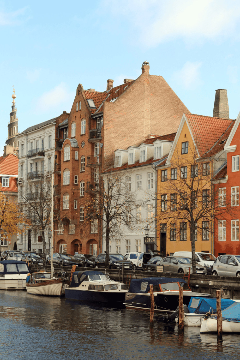 Bright colorful European waterfront buildings in a scenic harbor.