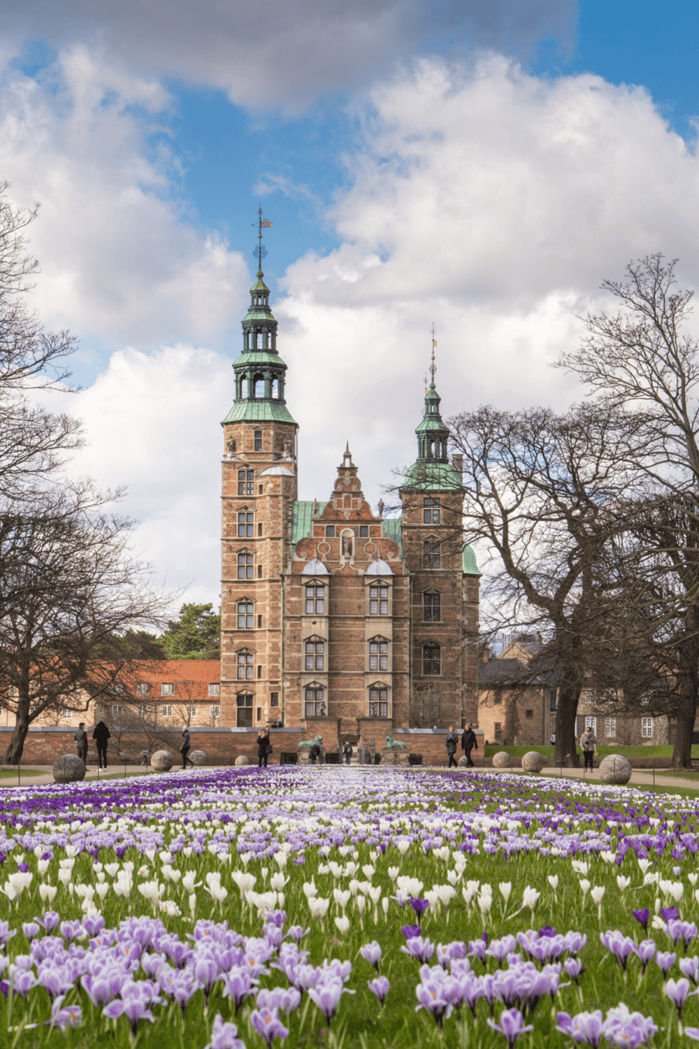 1. Historic castle with blooming garden, springtime sightseeing in Europe.
