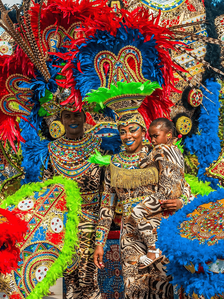 Vibrant carnival dancers in colorful feathered costumes celebrate cultural festival in Africa.