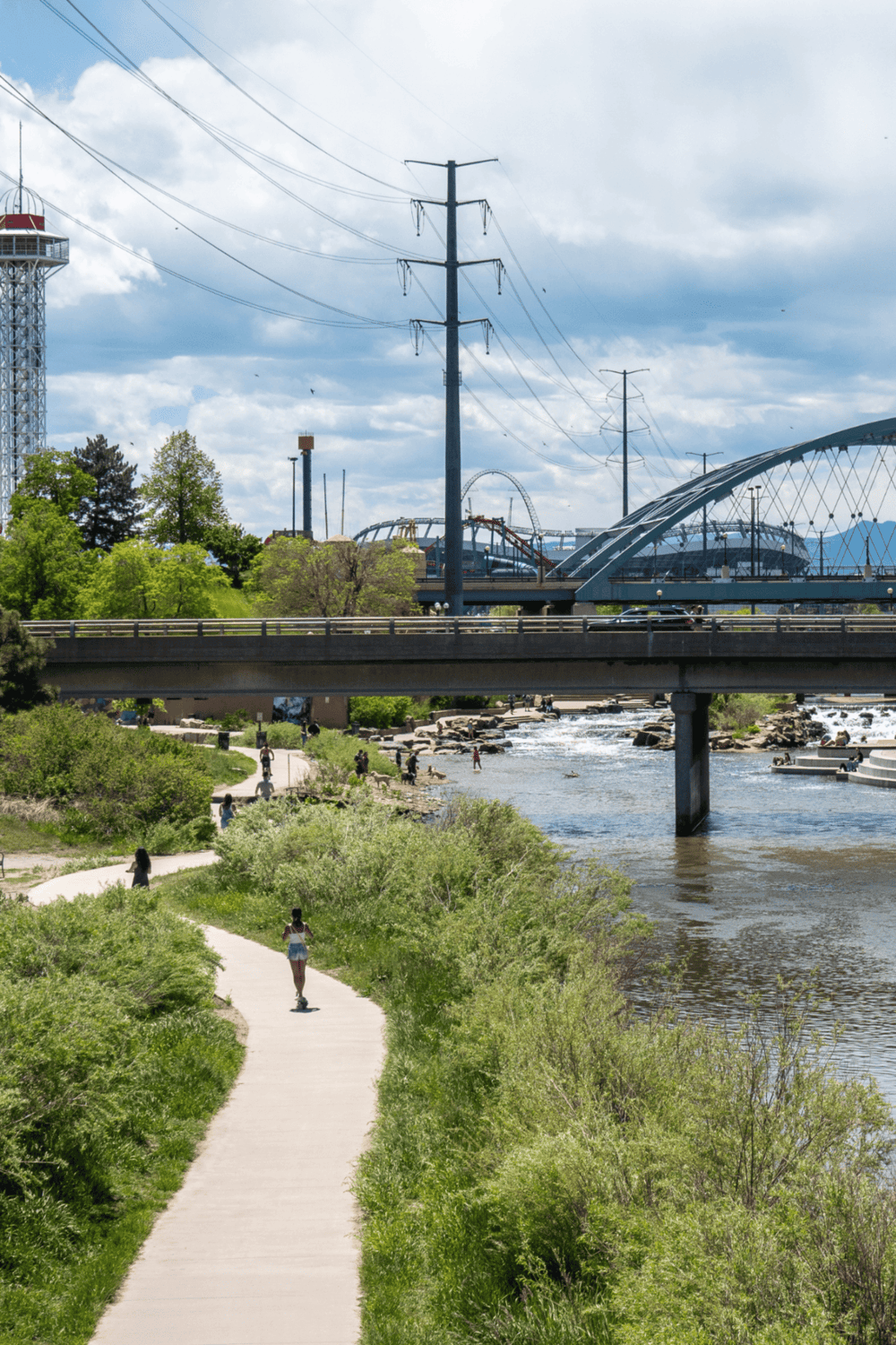 1. Beautiful riverside park with walking path and bridge in Portland, Oregon.