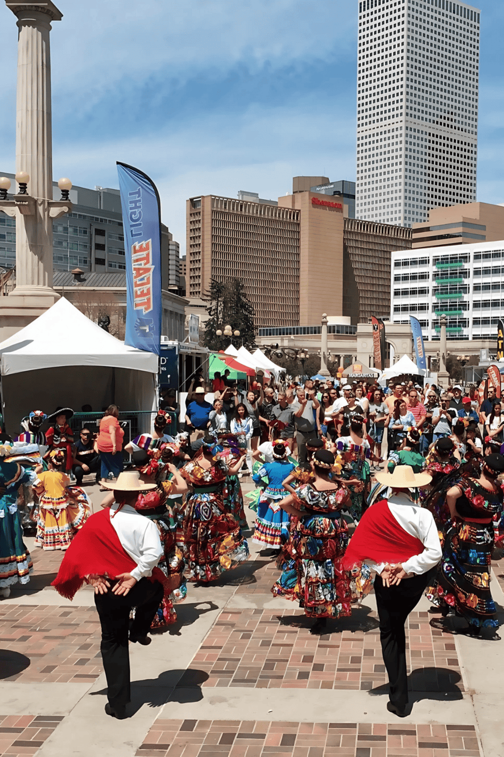 Traditional Mexican dance performance during cultural festival in downtown city.