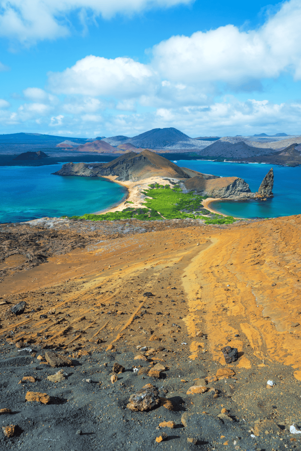 Vibrant island landscape with volcanic mountains, blue lagoon, and lush greenery, perfect for travel and adventure.