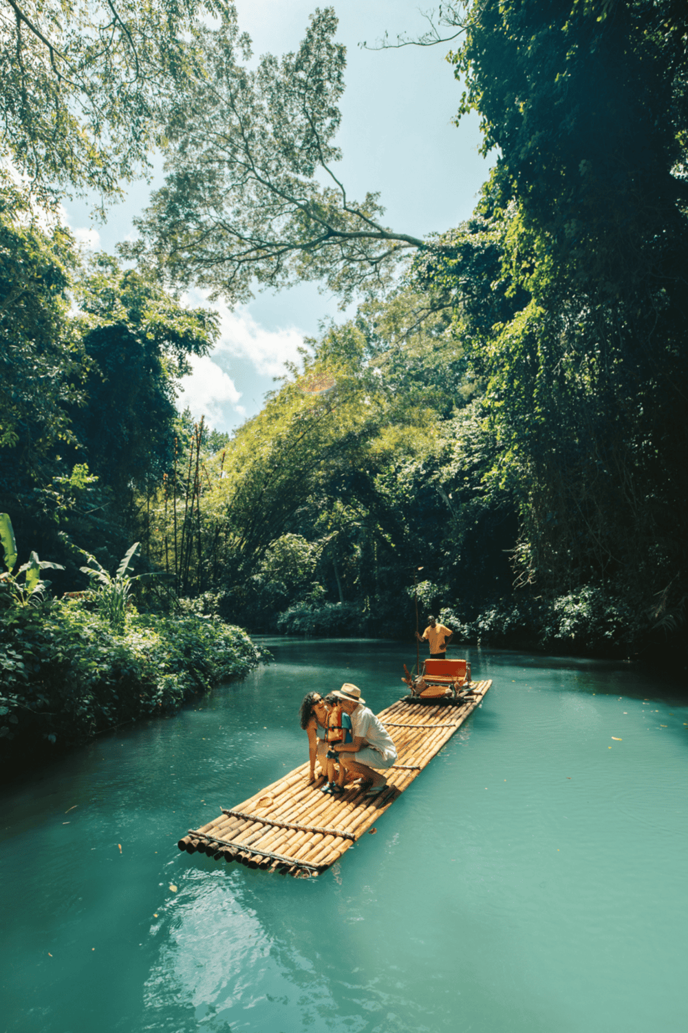 Tranquil jungle river tour on bamboo boat with lush greenery and scenic views.