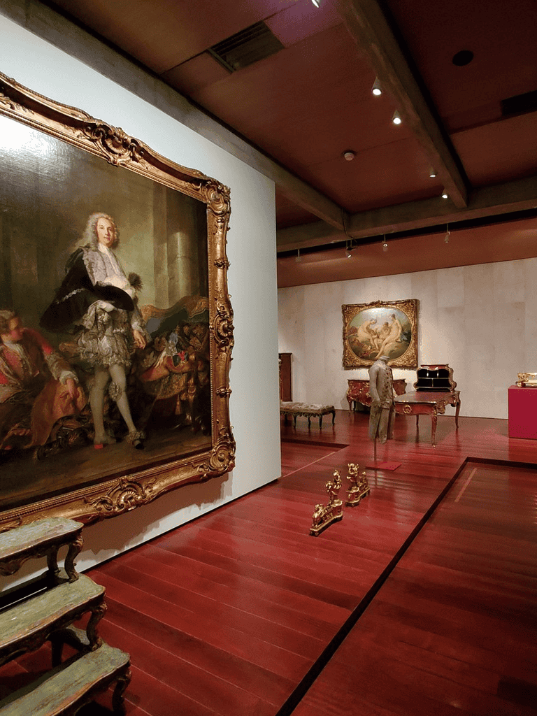 Elegant art gallery showcasing classic paintings and ornate furniture for cultural exploration and art appreciation.