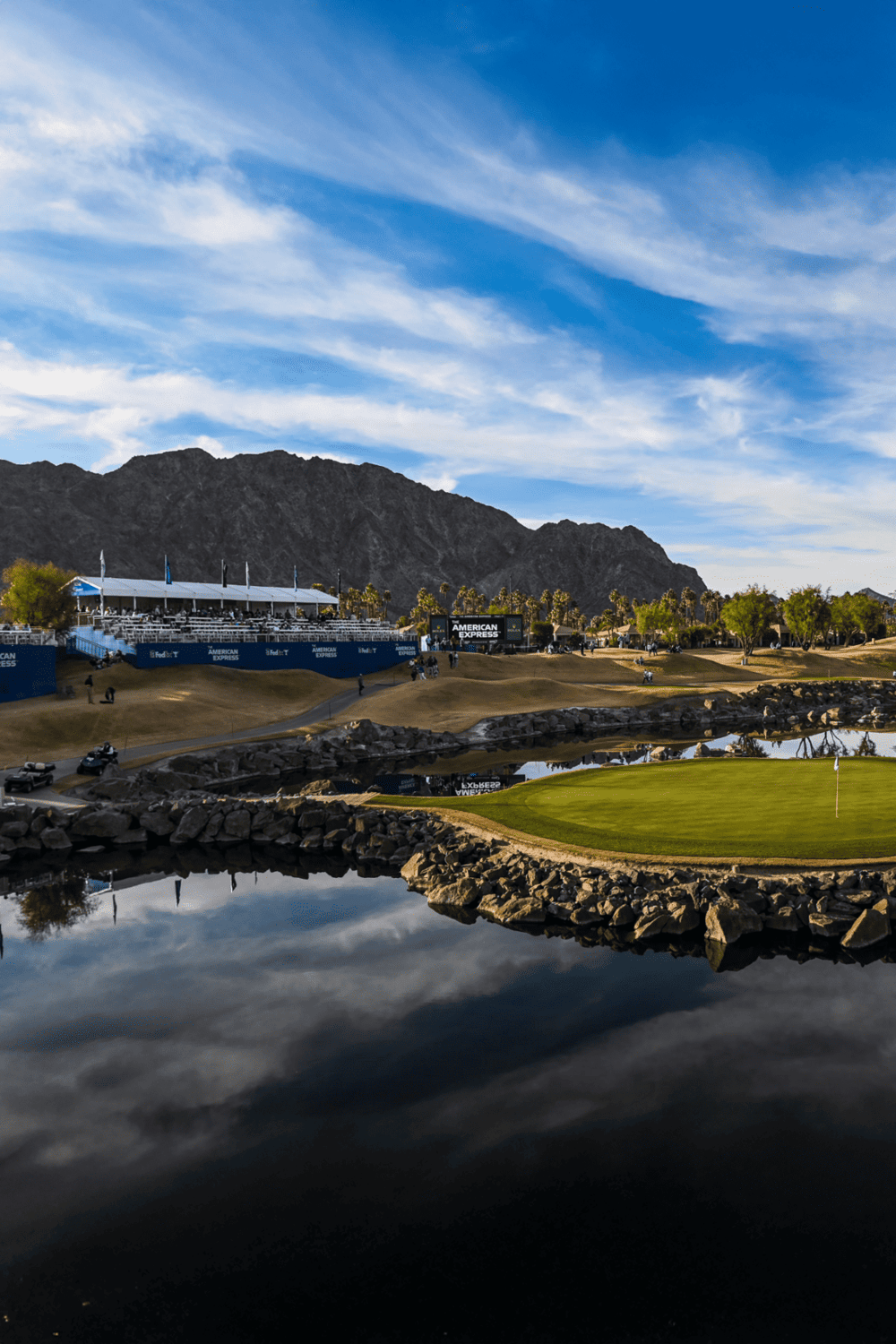Breathtaking desert golf course near mountain backdrop and scenic water features.