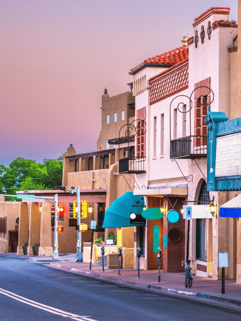 Colorful Albuquerque city street with unique architectural buildings and vibrant outdoor decor.